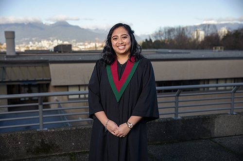Valedictorian Charmaine Paragas posing outside