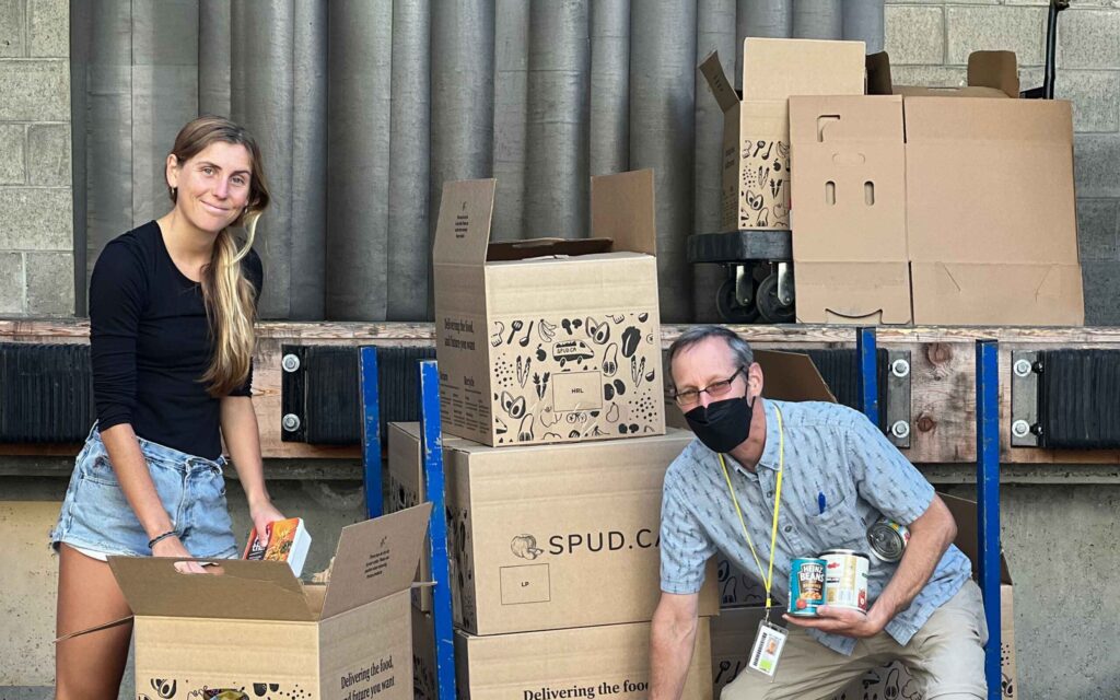 People packing boxes for Spud.ca, an online grocery delivery service