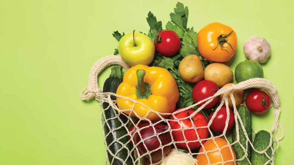 grocery bag full of fruits and vegetables