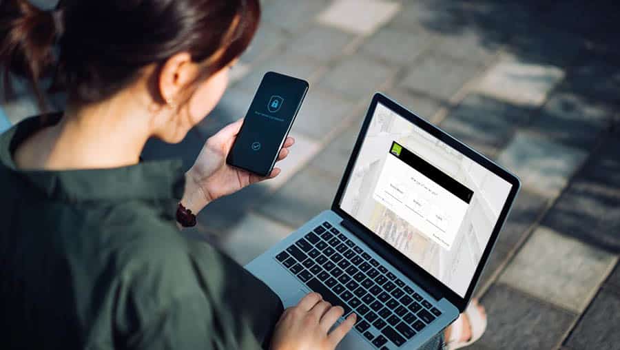 A person logs on to her laptop