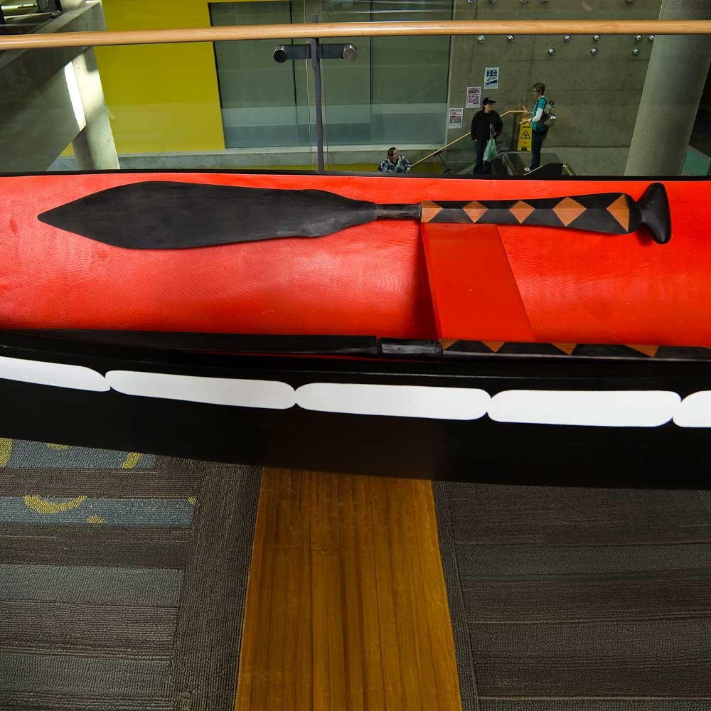 Indigigenous art of a wooden canoe paddle