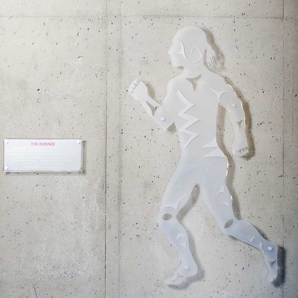 indigenous glass art of a runner