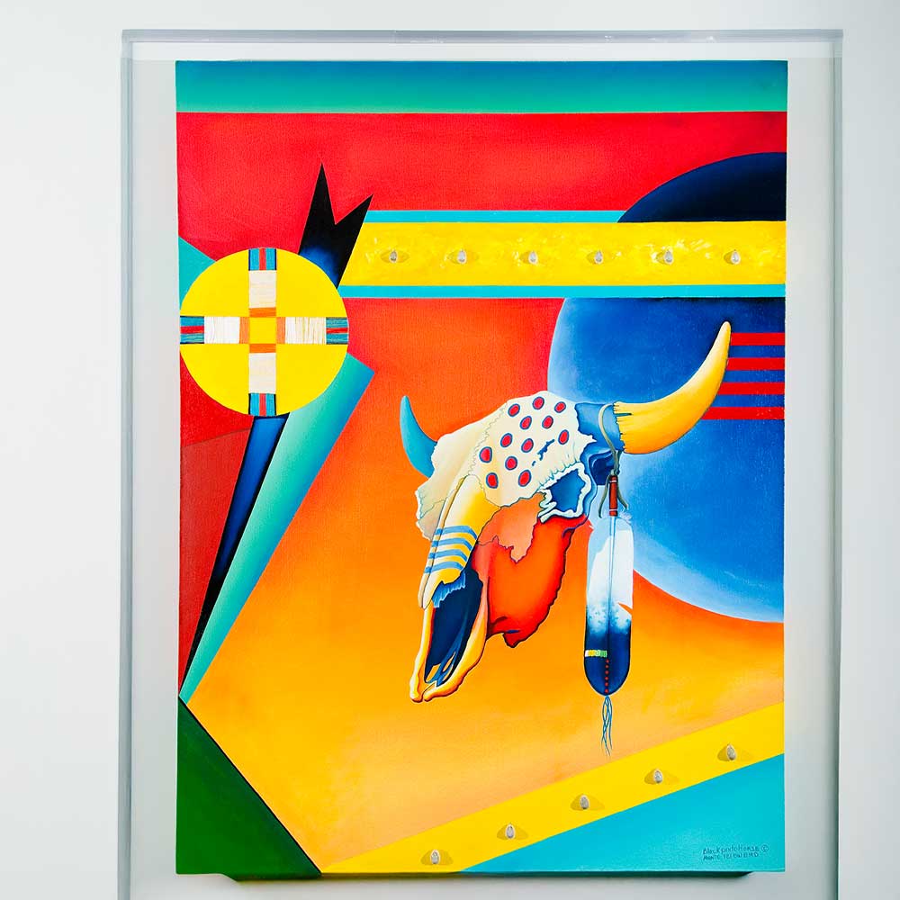 indigenous art painting of an animal skull with feathers and patterns