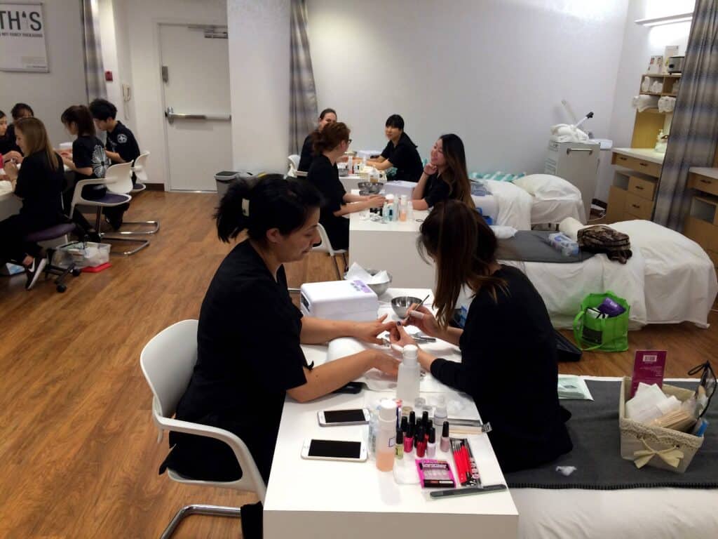 Salon and spa students being trained to do nails