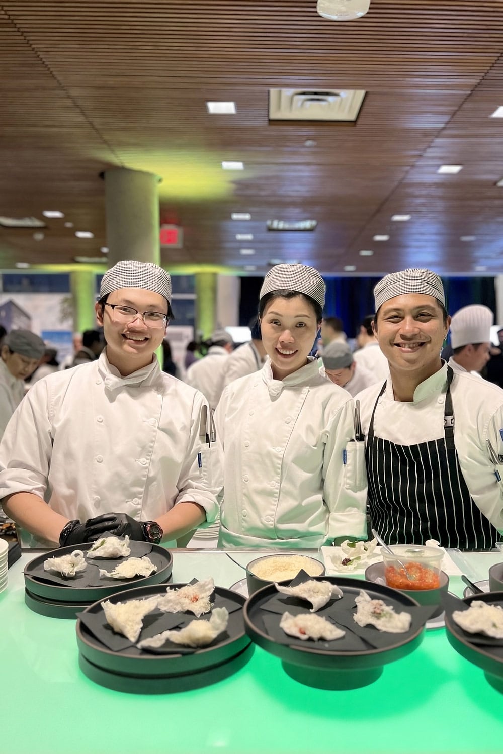 Three chefs at the Flourish gala presenting their dishes