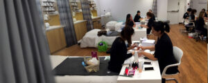 Esthetician students practice detailed manicures and hand treatments as part of their professional Nail Technology training.