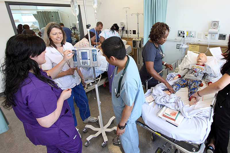 VCC nursing students diagnosing a fellow student for training purposes.